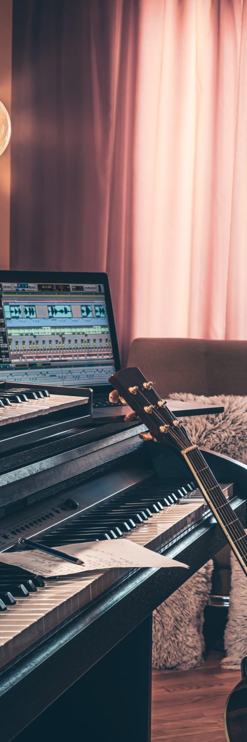 electronic piano and guitar in room interior.